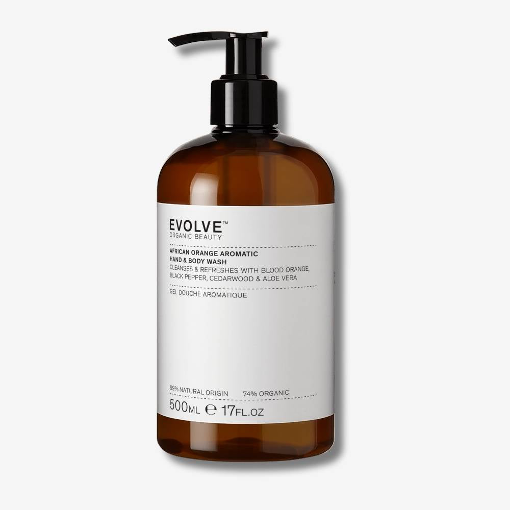Bottle of African Orange Aromatic Hand & Body Wash in 500ml size with pump on an off white background with shadow behind