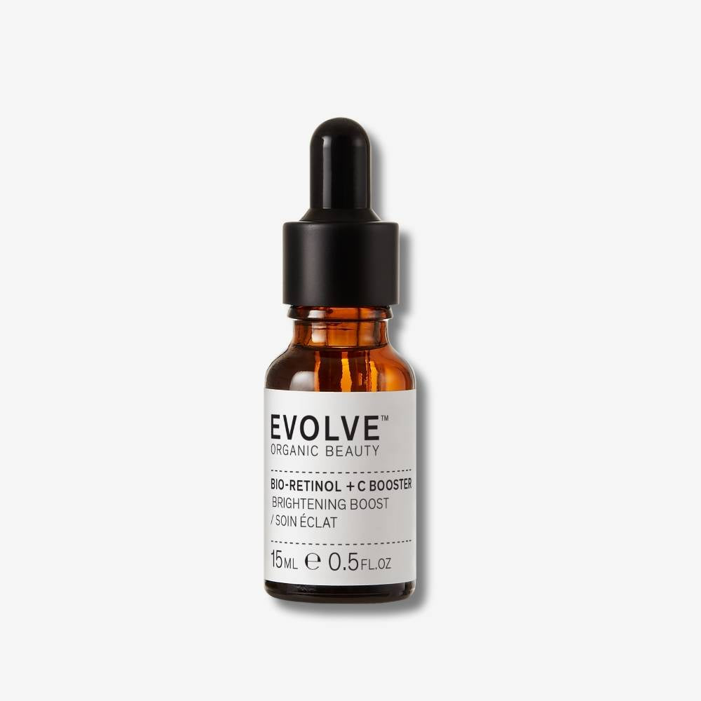 Evolve Organic Beauty Bio-retionl + C booster in brown glass bottle with black dropper on off white background with shadow behind
