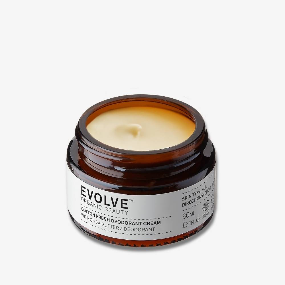Evolve Organic Beauty Cotton Fresh Deodorant in brown glass jar on off-white background with shadow behind