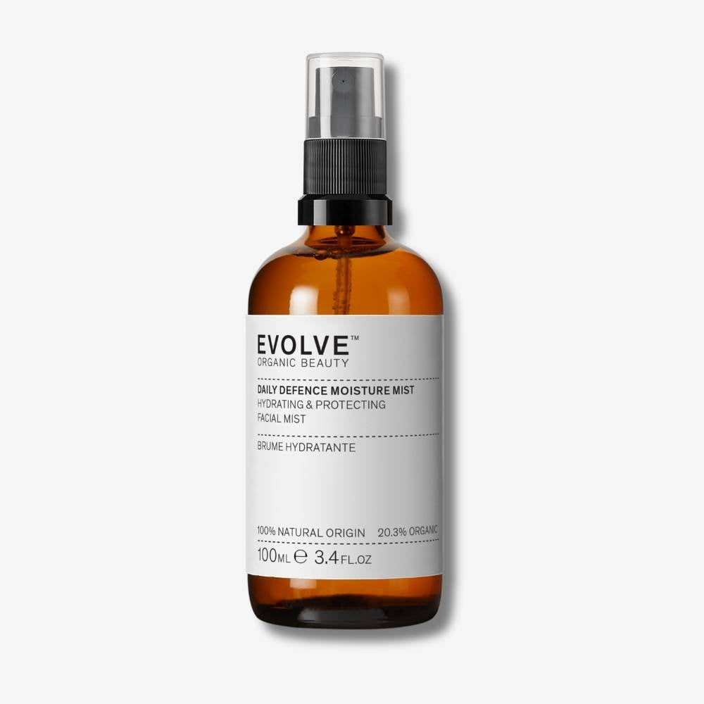 Evolve Organic Beauty Daily Defence Moisture Mist in brown glass bottle with mist pump lid on off white background with shadow behind
