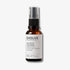 Evolve Organic Beauty Daily Detox Facial Wash in brown glass bottle with black pump lid on off white background with shadow behind