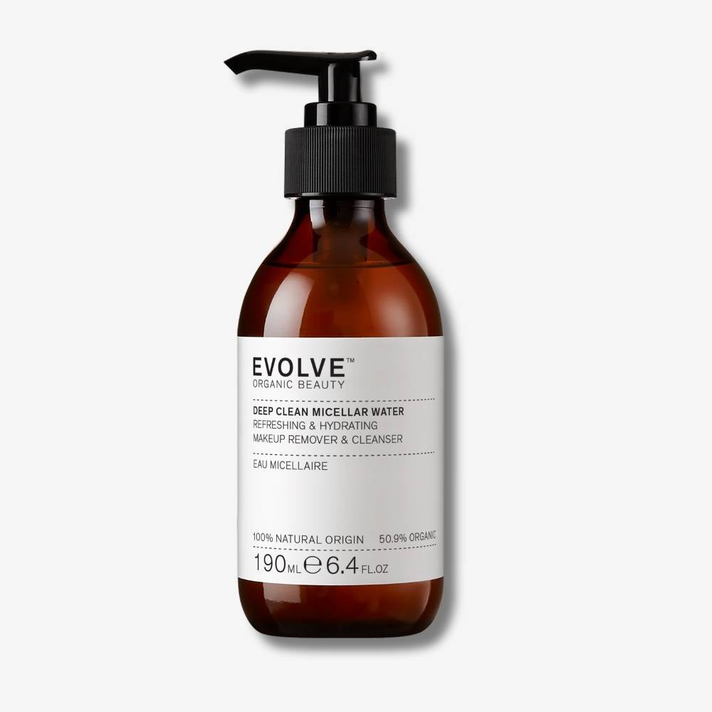 Evolve Organic Beauty Deep Clean Micellar Water in brown glass bottle with black pump lid on off white background with shadow behind