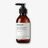 Evolve Organic Beauty Deep Clean Micellar Water in brown glass bottle with black pump lid on off white background with shadow behind