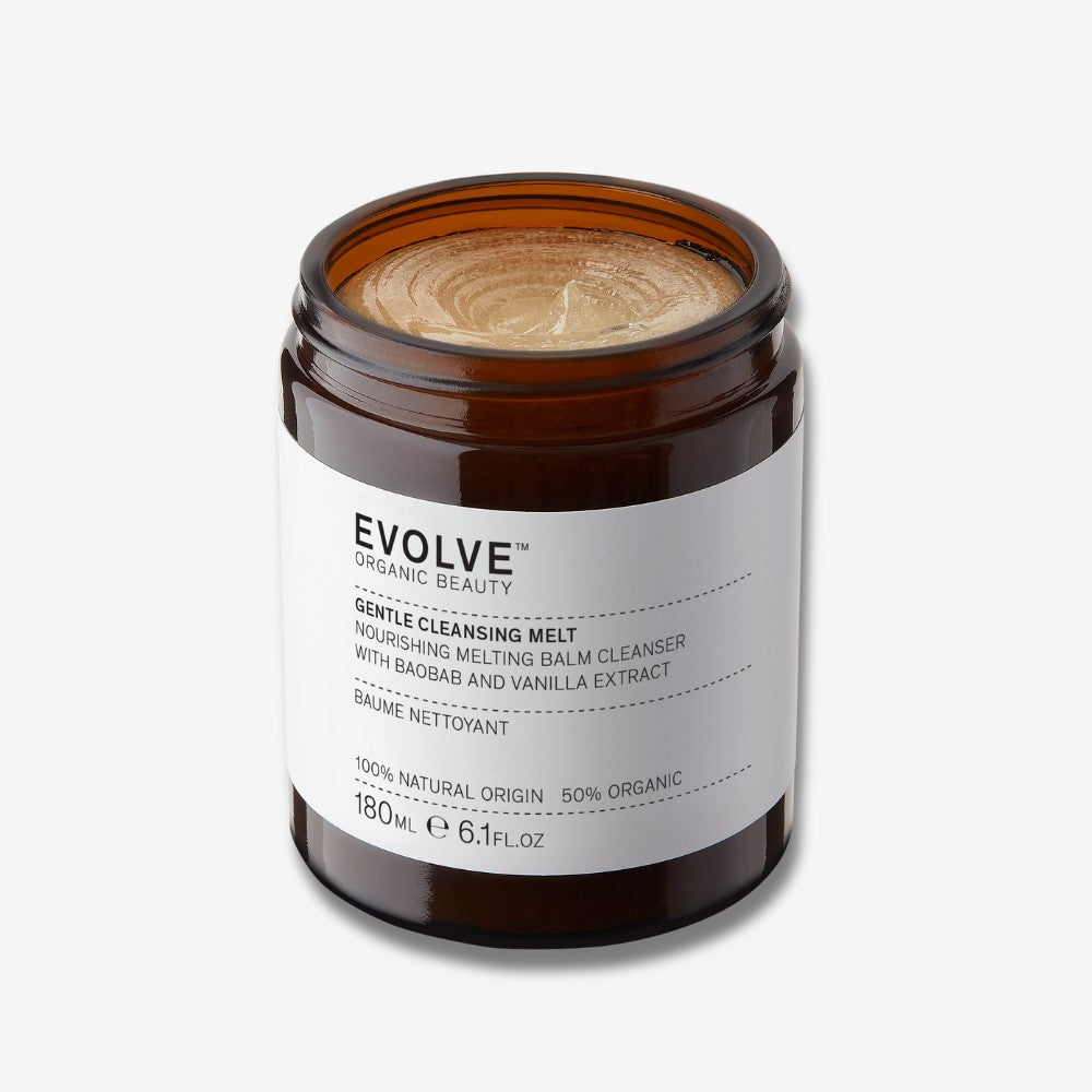 Evolve Organic Beauty Gentle Cleansing Melt in brown jar with black lid on off white background with shadow behind