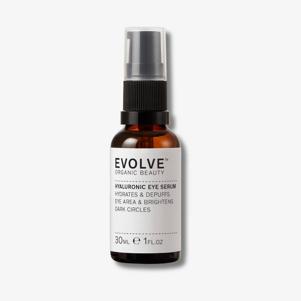Evolve Organic Beauty Hyaluronic Eye Serum in brown glass bottle with black pump lid on off white background with shadow behind