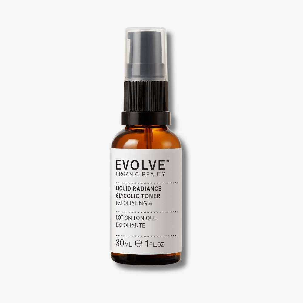 Evolve Organic Beauty Liquid Radiance Glycolic Toner in brown glass bottle with black pump lid on off white background with shadow behind
