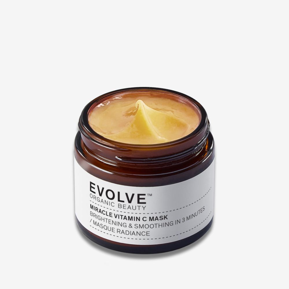 evolve organic beauty miracle vitamin c mask open amber jar showing bright orange texture of mask inside on off white background