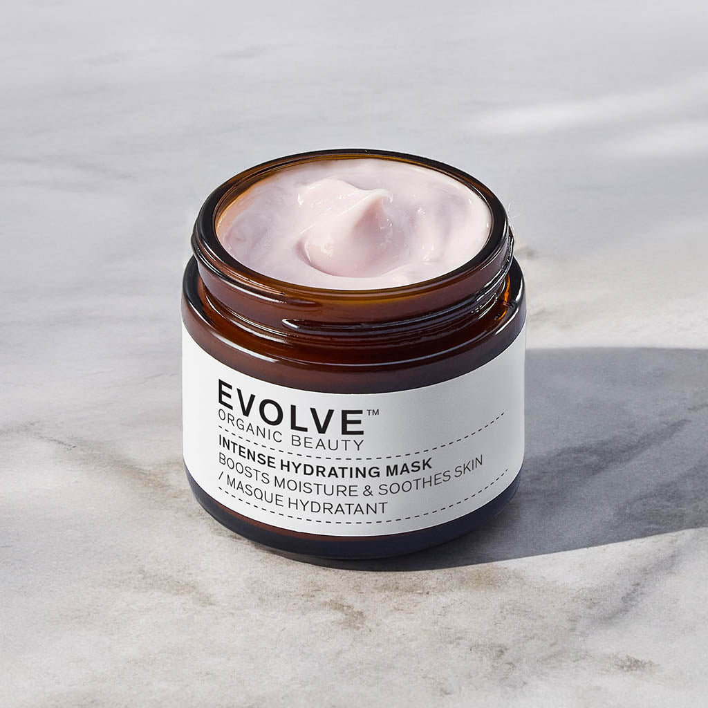 open jar of intense hydrating mask on marble table