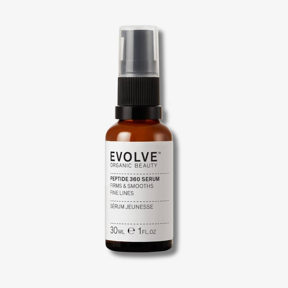 Evolve Organic Beauty Peptide 360 Serum in brown glass bottle with black pump lid on off white background with shadow behind