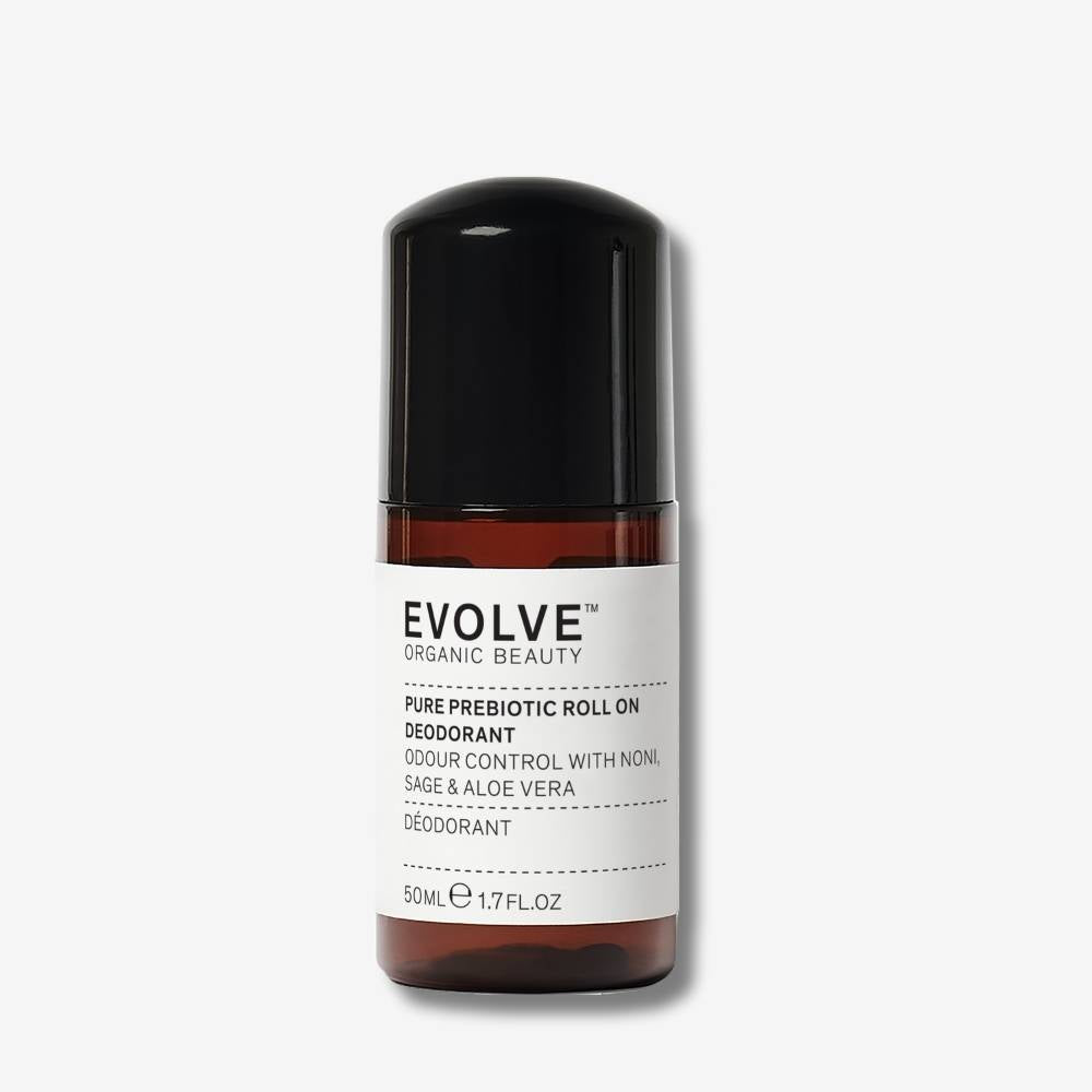 Evolve Organic Beauty Pure Prebiotic Roll On Deodorant in brown bottle with black lid on off-white background with shadow behind