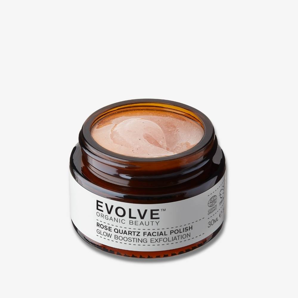 evolve organic beauty open amber jar showing soft pink texture of travel sized rose quartz facial polish