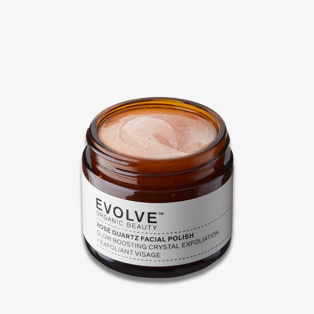 evolve organic beauty open amber jar showing soft pink texture of rose quartz facial polish