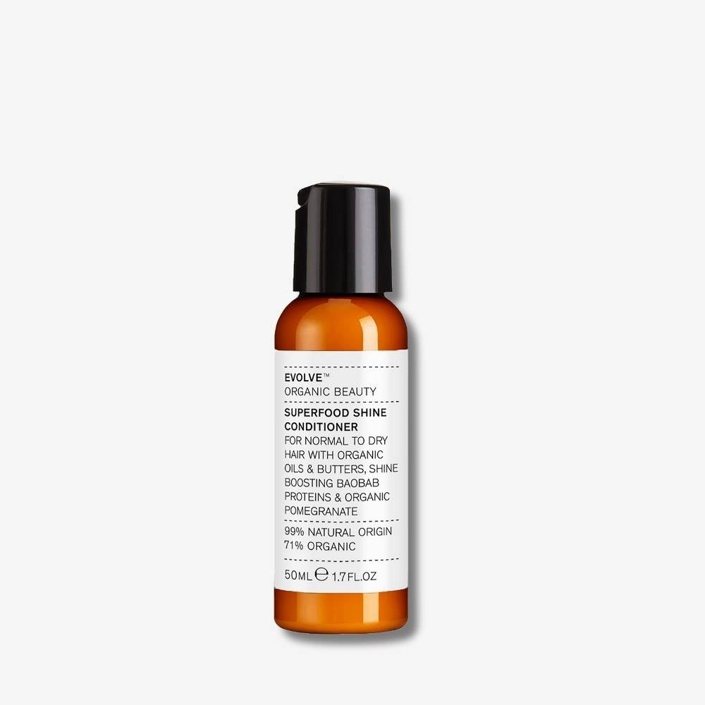 Evolve Organic Beauty Superfood Shine Conditioner 50ml bottle with black disc cap lid on off-white background with shadow behind