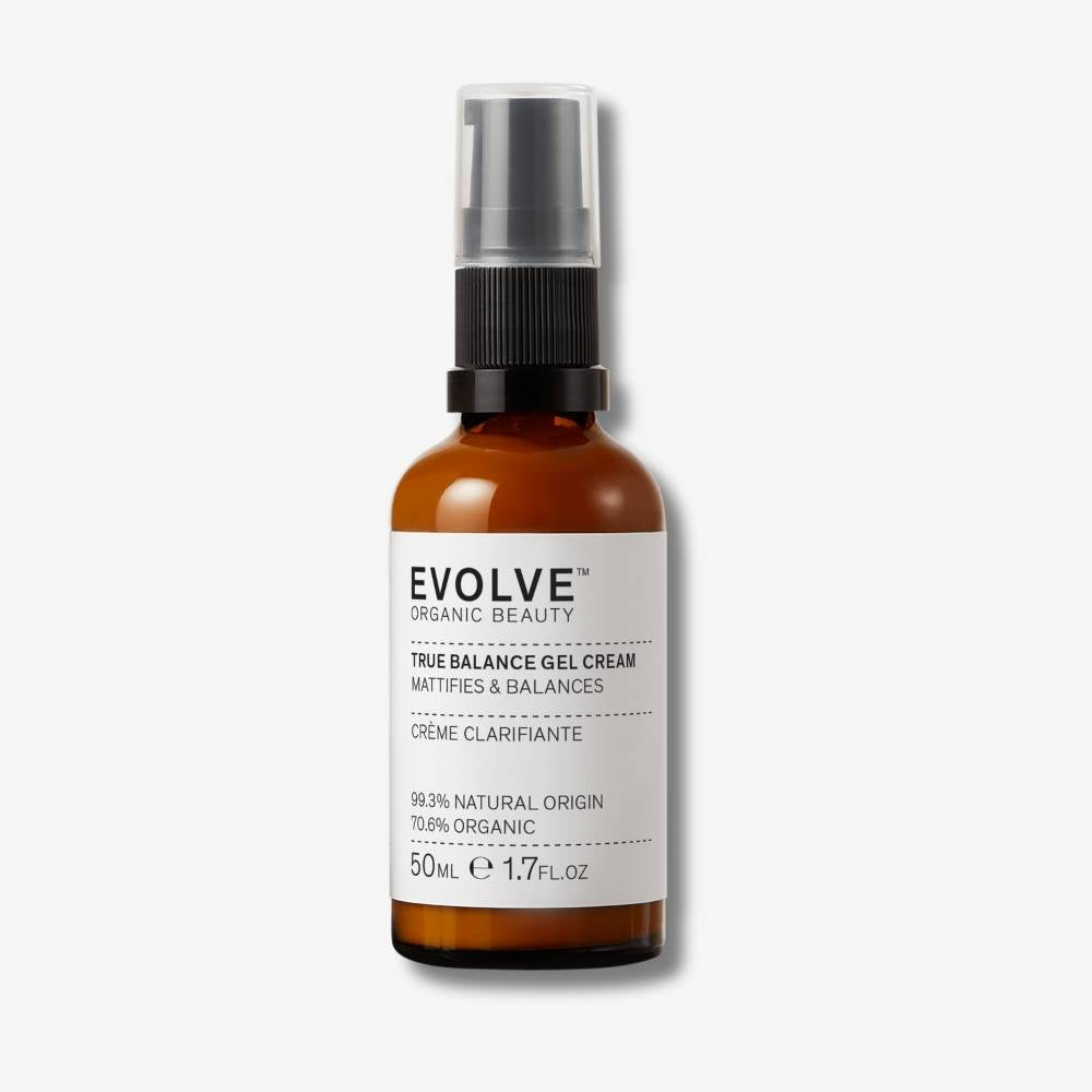 Evolve Organic Beauty True Balance Gel Cream in brown glass bottle with black pump lid on off white background with shadow behind