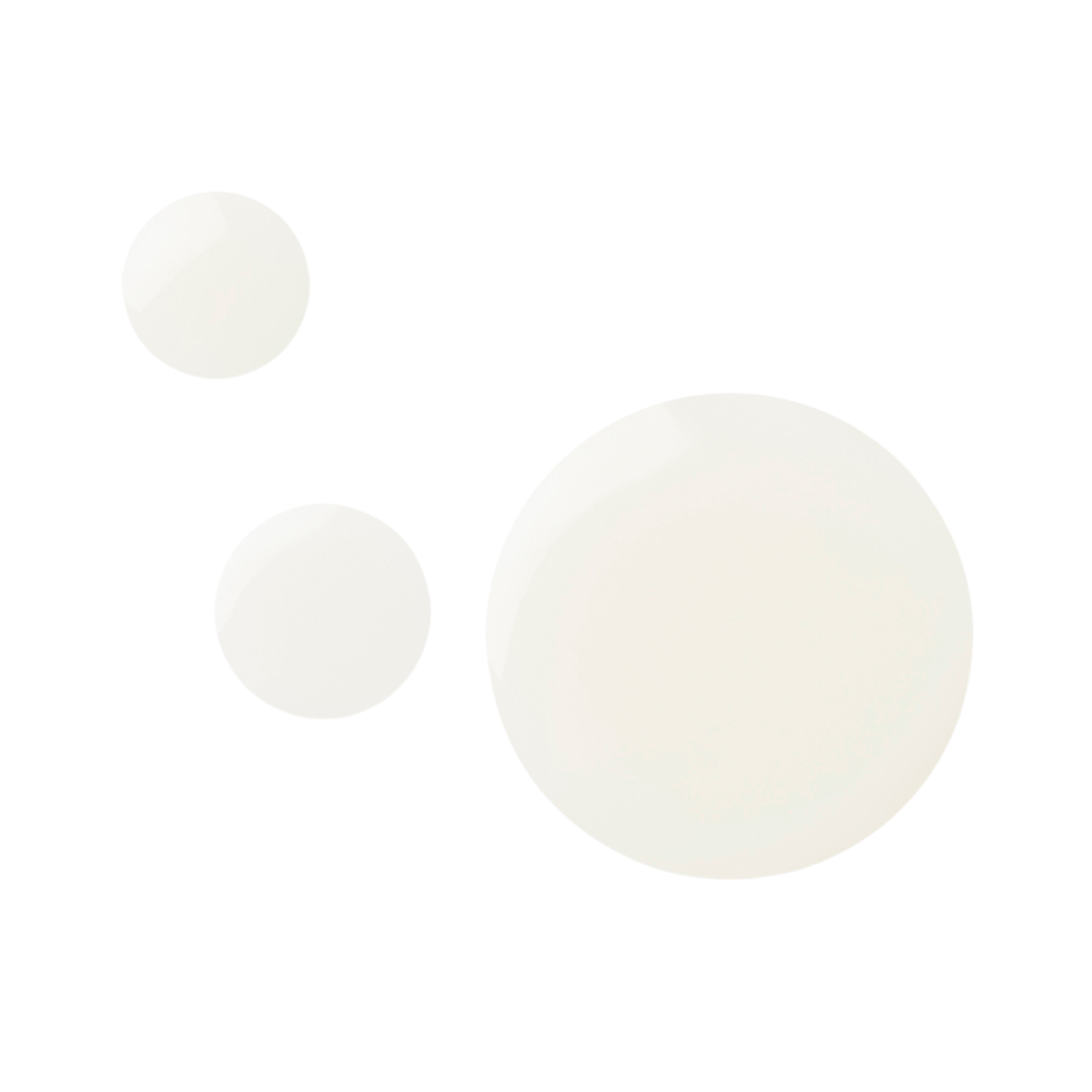 Droplets of Zen Whisper Sleep Mist on an off-white background