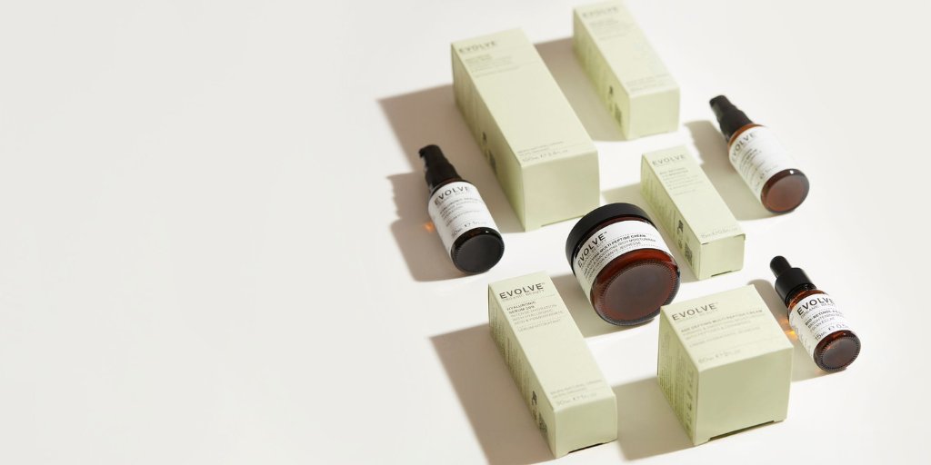 group shot of evolve green packaging and products in flatlay