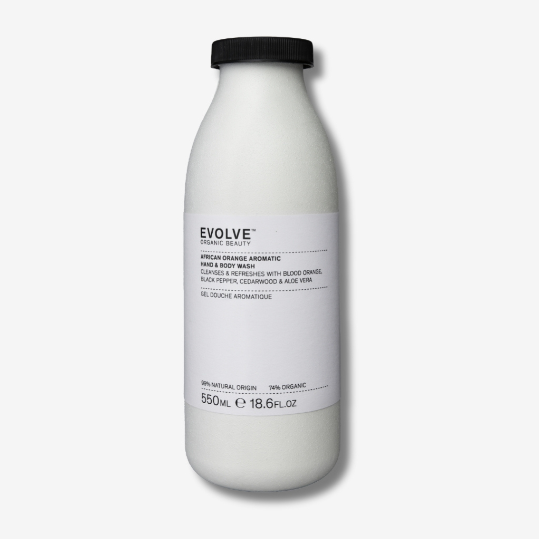 Evolve Organic Beauty African orange aromatic hand and body wash i first-ever commercial refill products in their sustainable fibre-based bottles on off white background with shadow behind