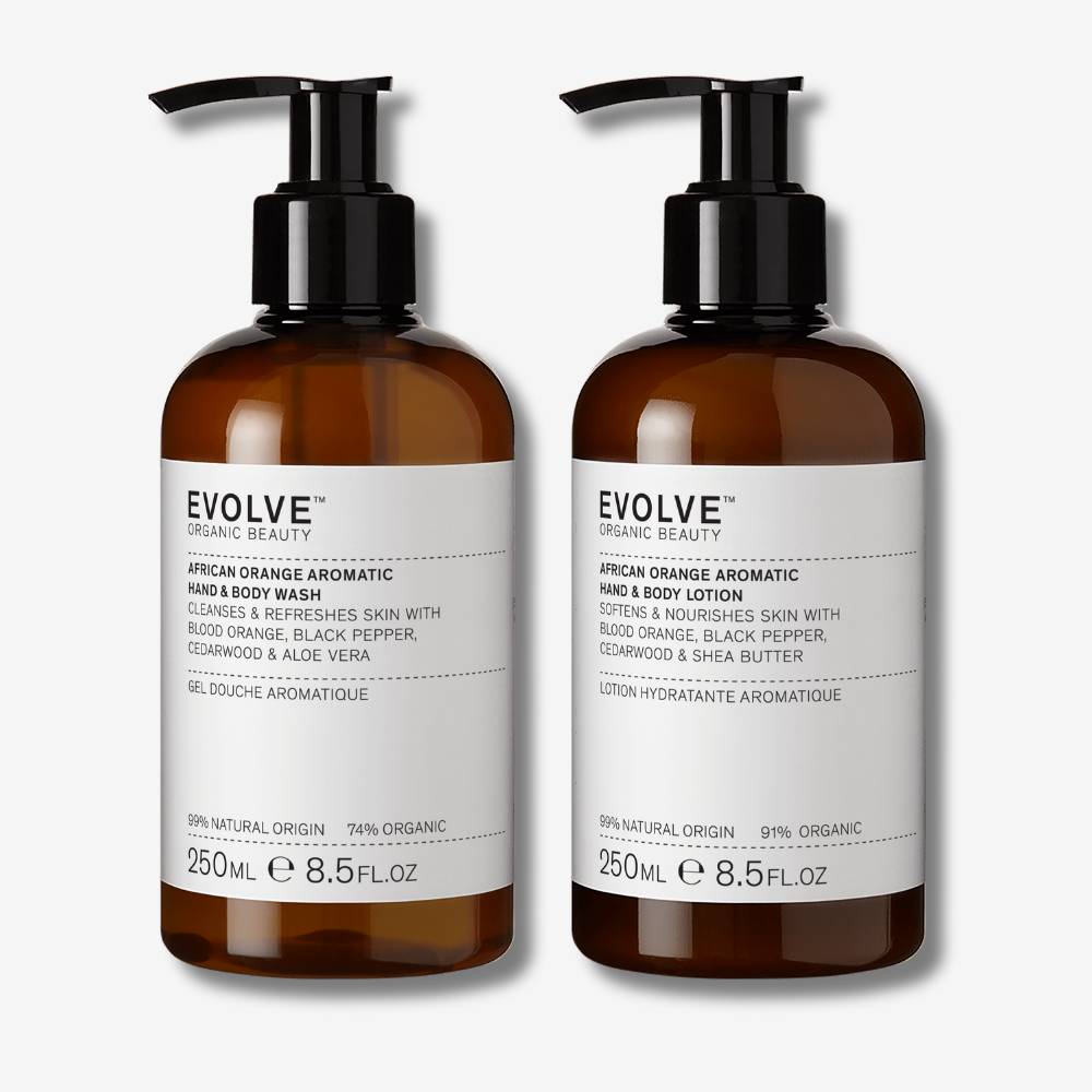 Evolve Organic Beauty african orange aromatic duo in brown recycled plastic bottle with black pump lid on off white background with shadow behind