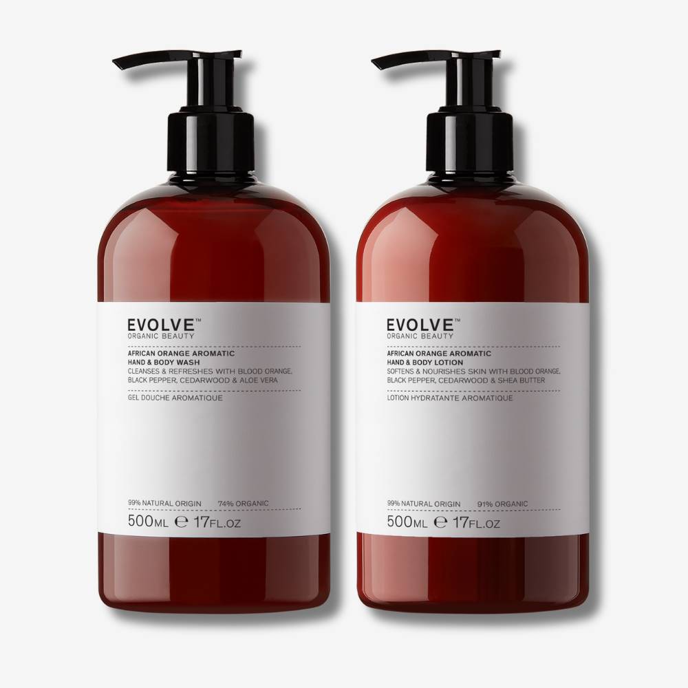 Evolve Organic Beauty african orange aromatic supersize duo in brown recycled plastic bottle with black pump lid on off white background with shadow behind