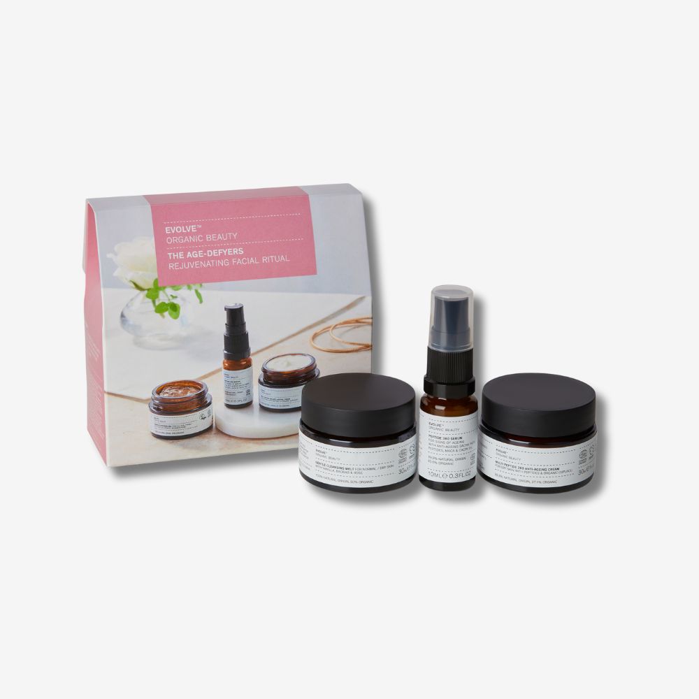 evolve organic beauty age defyers gift set with pink gift box on off white background