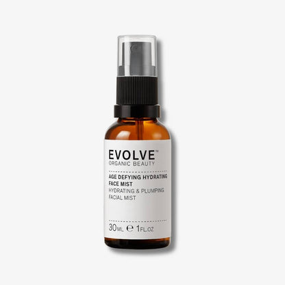 Evolve Organic Beauty Age Defying Hydrating Face Mist in brown glass bottle with black mist lid on off white background with shadow behind