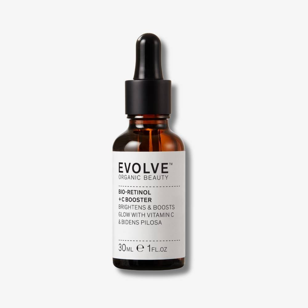 Evolve Organic Beauty Bio-retinol + C booster in brown glass bottle with black dropper on off white background with shadow behind
