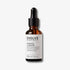 Evolve Organic Beauty Bio-retinol + C booster in brown glass bottle with black dropper on off white background with shadow behind