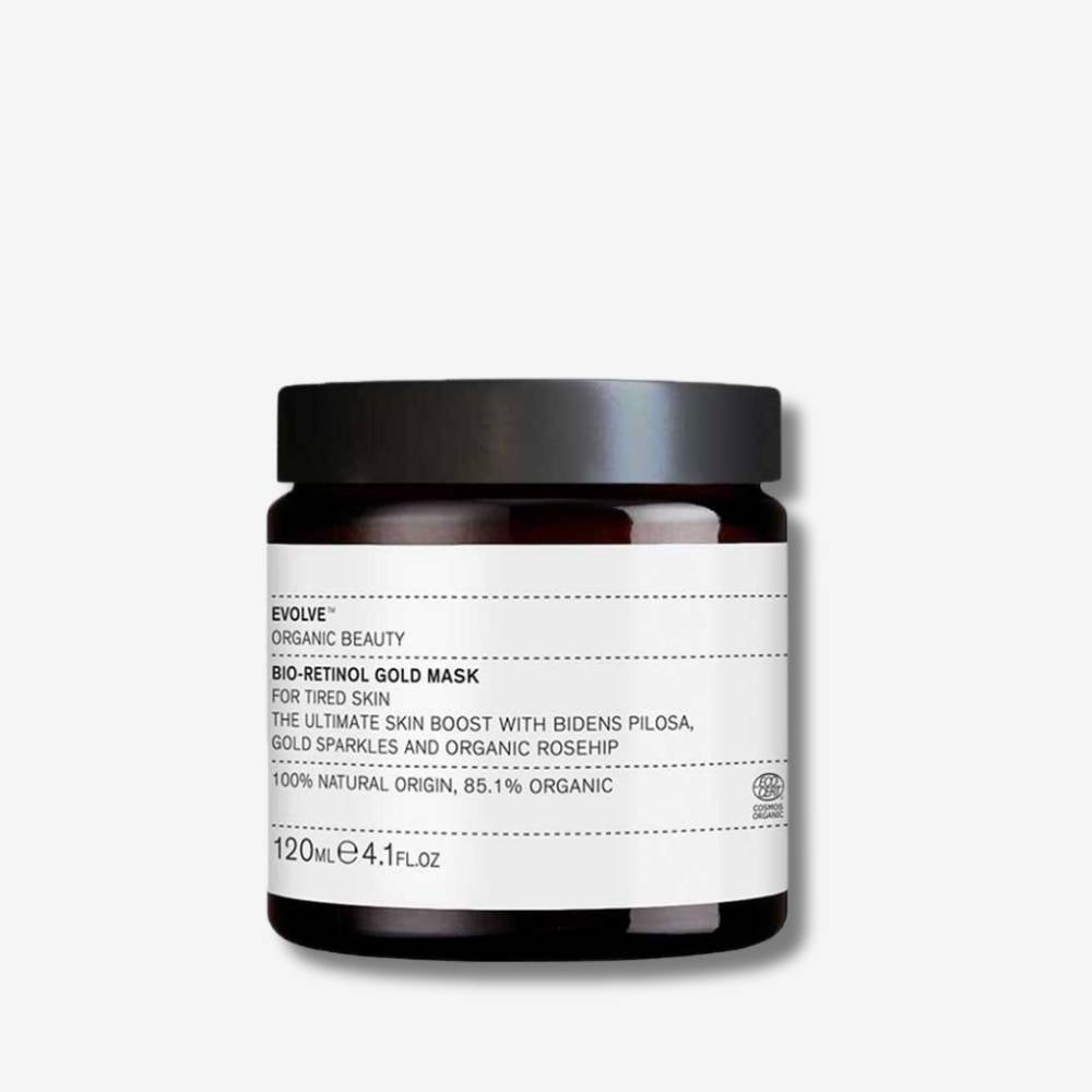 Evolve Organic Beauty Bio-Retinol Gold Mask in brown glass jar with balck lid on off white background with shadow behind