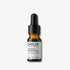 Evolve Organic Beauty Blue Velvet Ceramide Serum in brown glass travel size bottle with black pipette lid on off white background with shadow behind