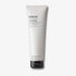 Evolve Organic Beauty Body Sculpting Cellulite Cream in white sugar cane squezable tube with black plastic lid on off white background with shadow behind
