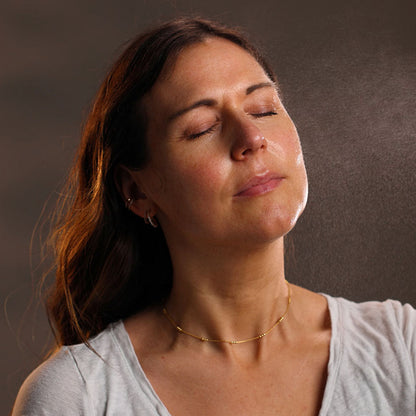 woman applying age defying hydrating face mist