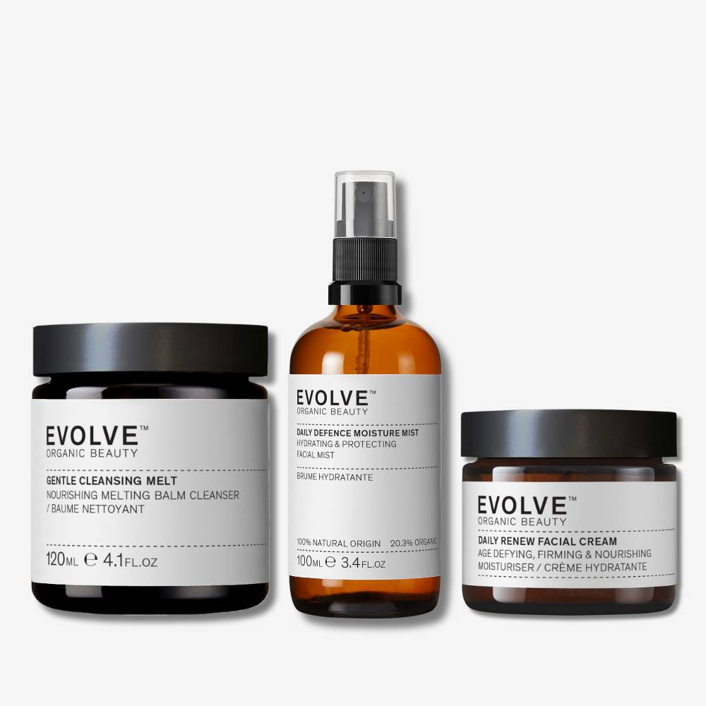 evolve organic beauty packshots of gentle cleansing melt, daily defence moisture mist and daily renew facial cream on off white background