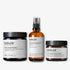 evolve organic beauty packshots of gentle cleansing melt, daily defence moisture mist and daily renew facial cream on off white background