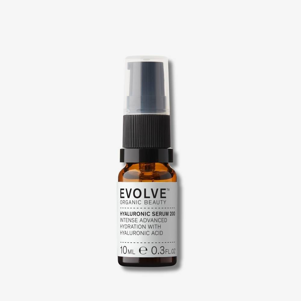 Evolve Organic Beauty Hyaluronic Serum 200 in brown glass bottle with black pump lid on off white background with shadow behind