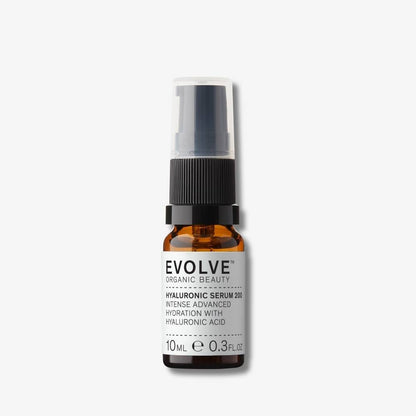 Evolve Organic Beauty Hyaluronic Serum 200 in brown glass bottle with black pump lid on off white background with shadow behind