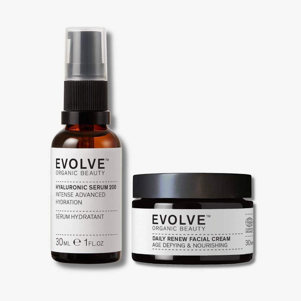 evolve organic beauty packshot of hyaluronic serum 200 next to daily renew facial cream on off white background