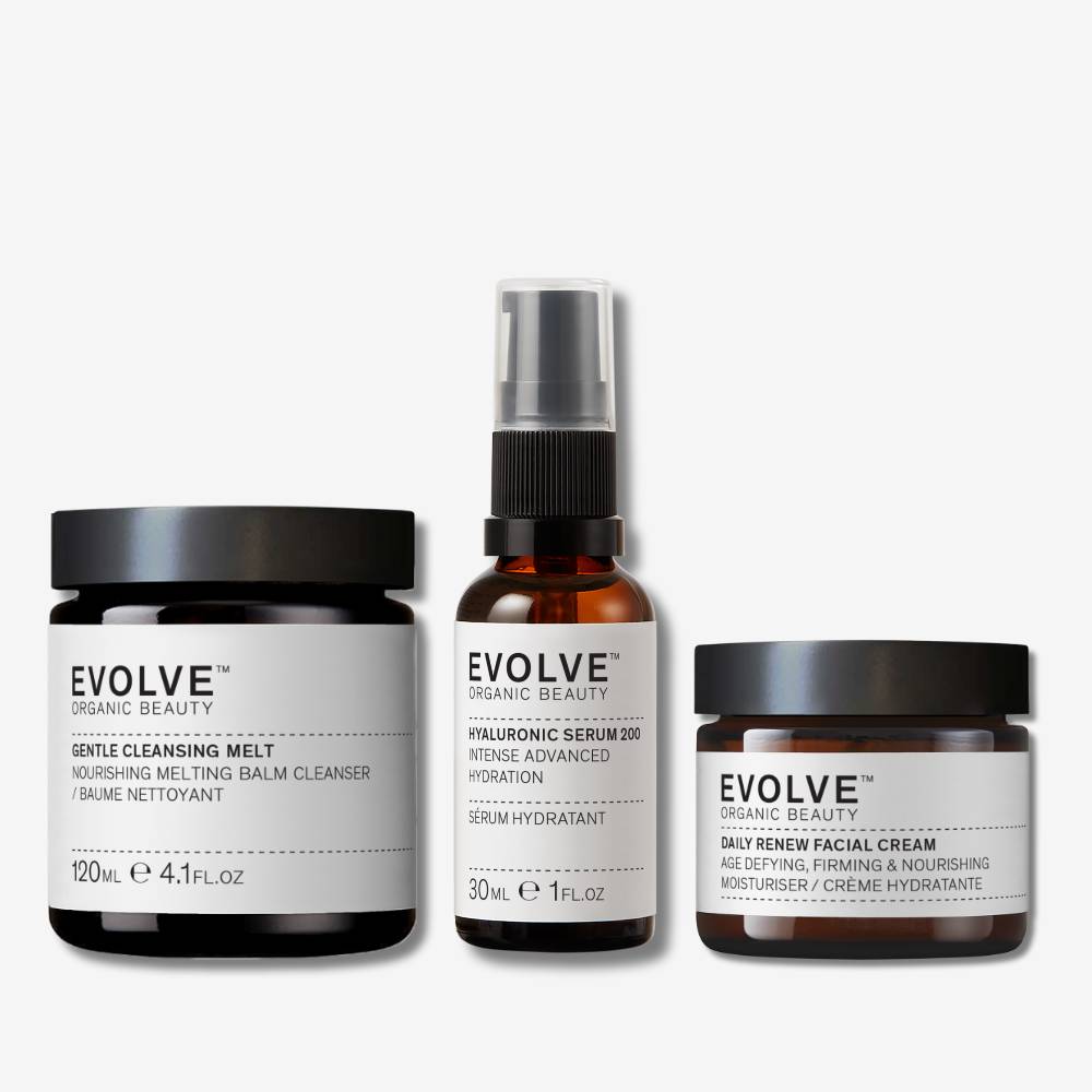 evolve organic beauty packshots of gentle cleansing melt, hyaluronic serum 200 and daily renew facial cream on off white background