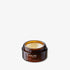 Open amber jar showing the texture of Lip Treat with shadow behind