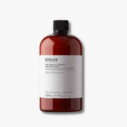 Evolve Organic Beauty Pure tranquility aromatic hand and body lotion in brown  plastic bottle with black screw cap on off white background with shadow behind