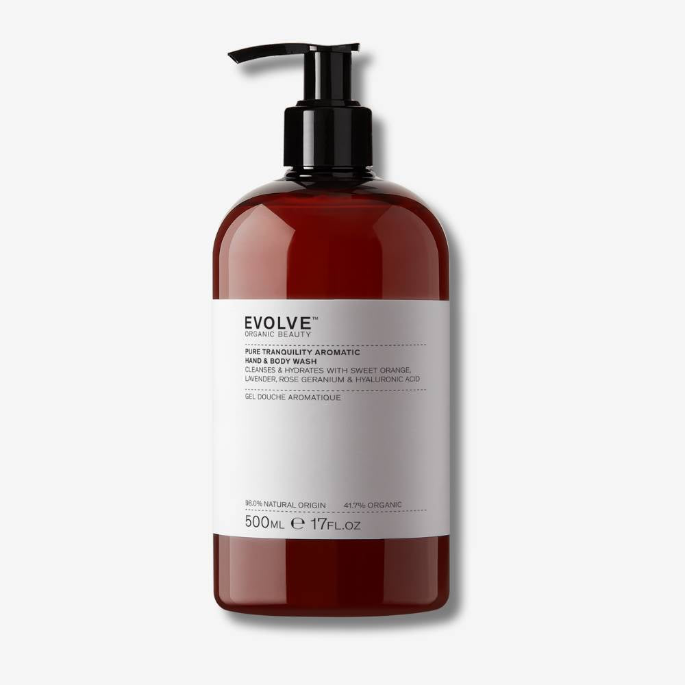 Evolve Organic Beauty Pure tranquility aromatic hand and body was Supersize in brown  plastic bottle with black pump lid on off white background with shadow behind