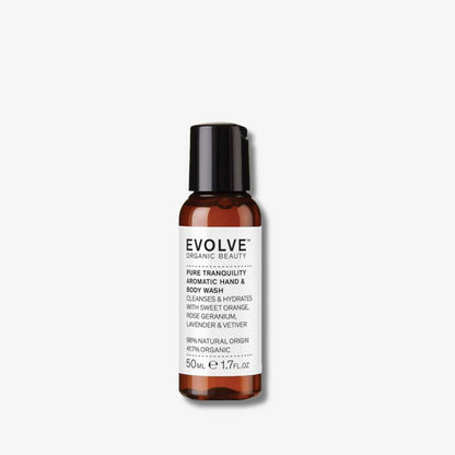 Evolve Organic Beauty Pure tranquility aromatic hand and body wash travel size in brown  with black lid on off white background with shadow behind