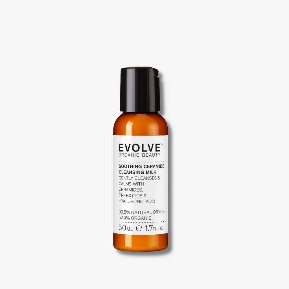 Plastic bottle with black cap of Evolve Organic Beauty cleansing balm on a white background
