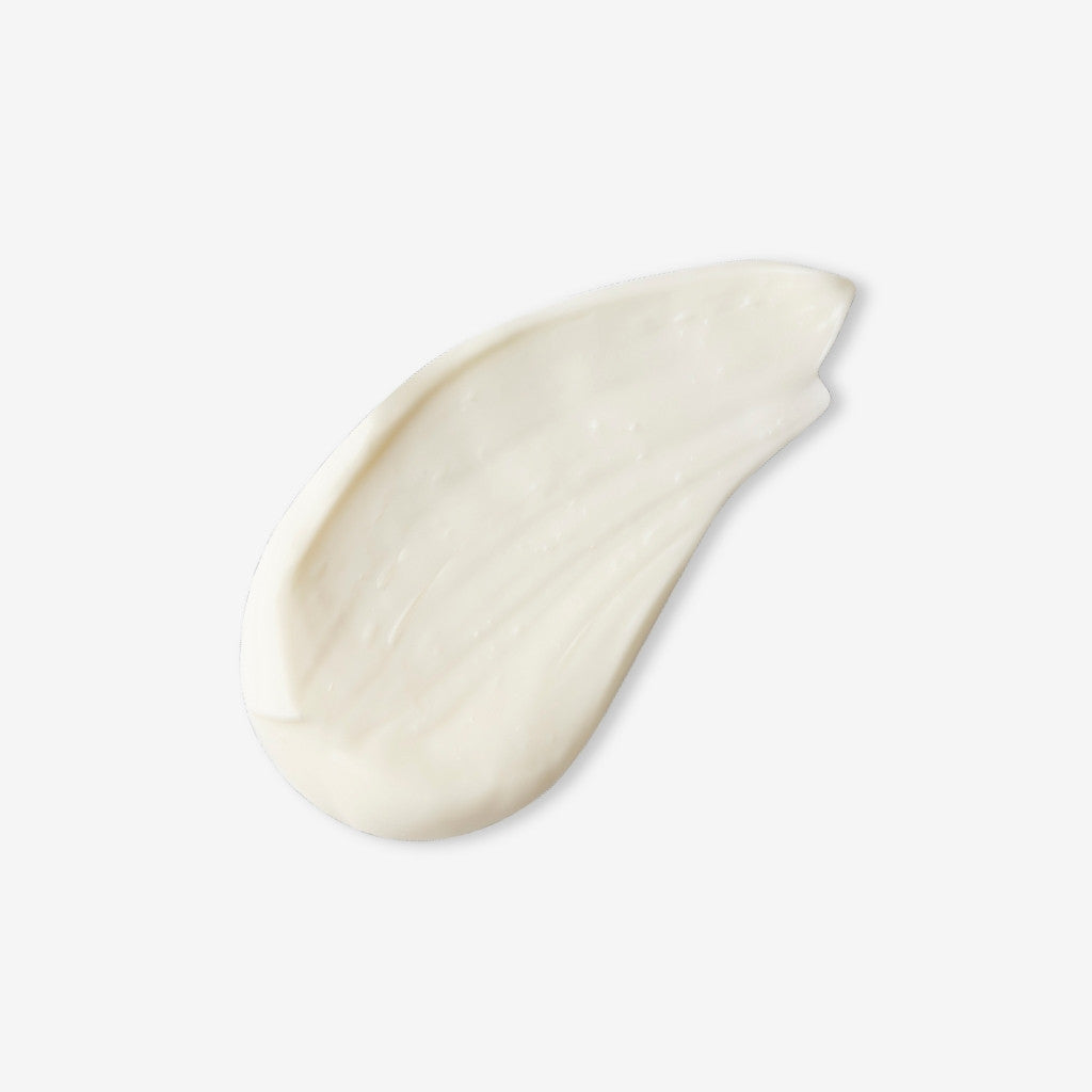 Swatch of Timeless Renewal Hand Cream on an off white background with shadow behind