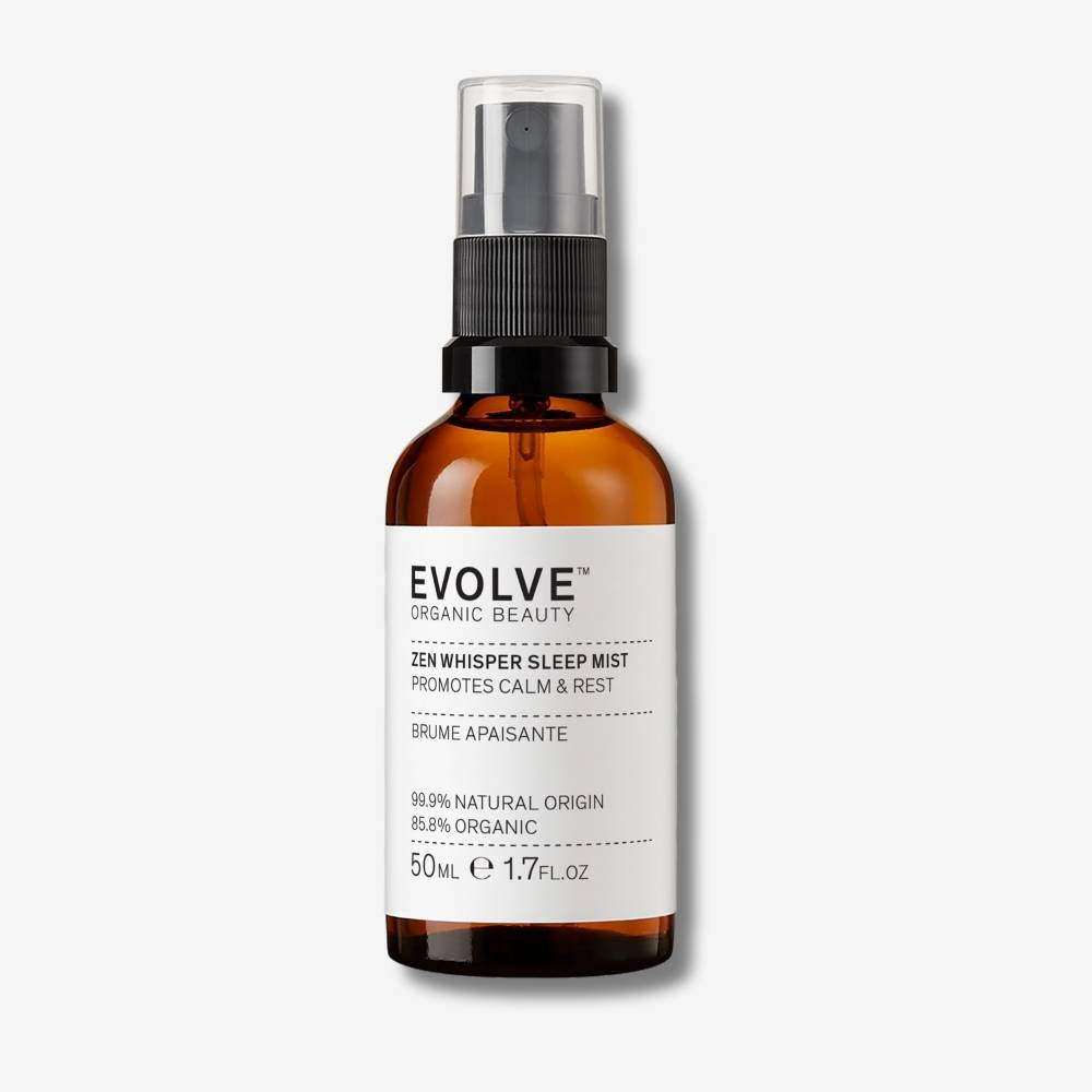 Evolve Organic Beauty Zen Whisper Sleep Mist in brown glass bottle with black spray pump on an off-white background with shadow behind