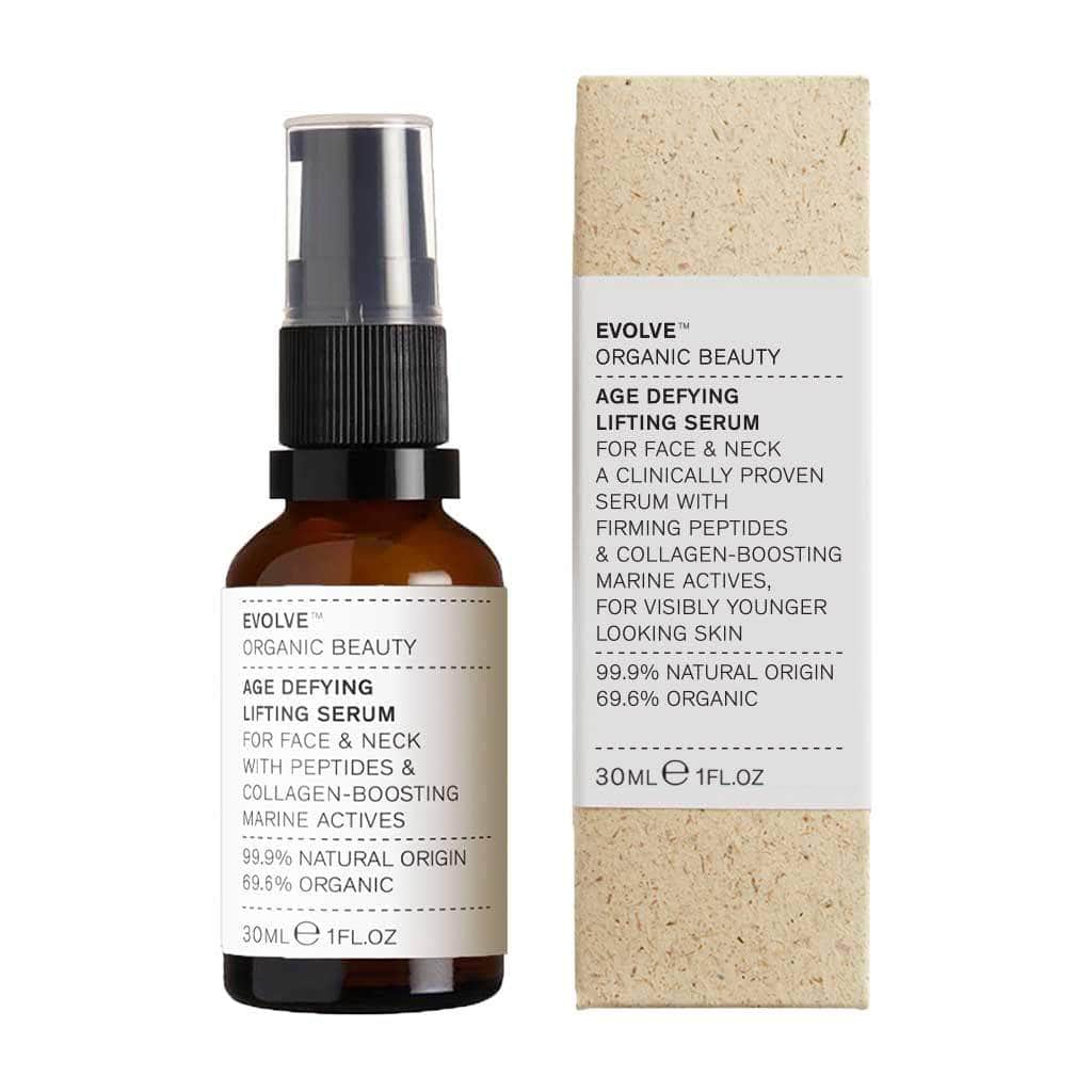 Evolve organic skincare lifting in amber glass bottle next to compostable grass box