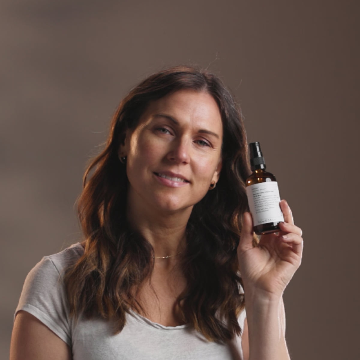 video showing woman using age defying hydrating face mist